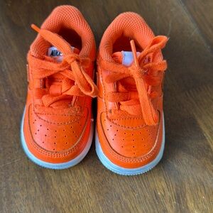 Orange Nike shoes